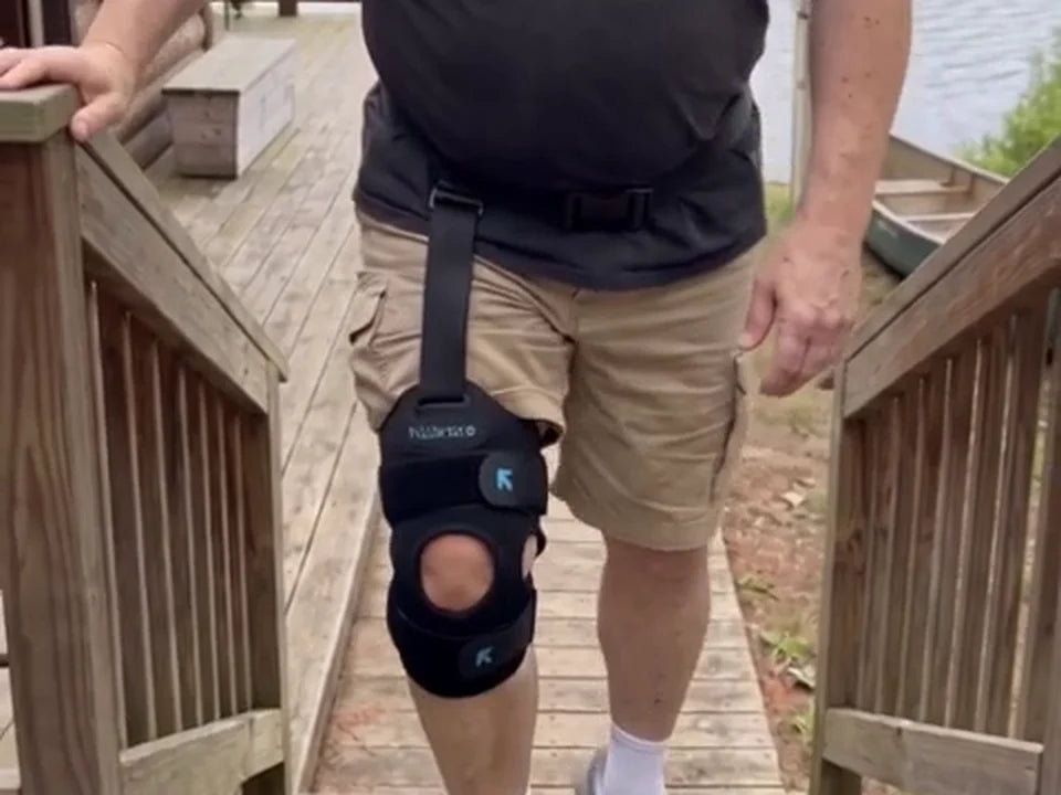 Shane walking down his deck steps wearing Walk Assist