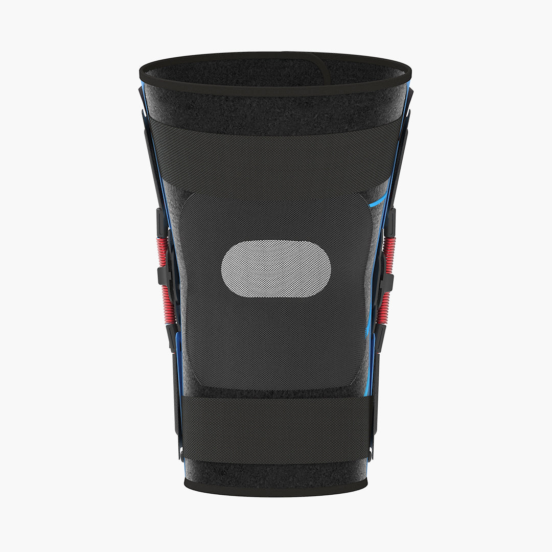 Back view of the Nübrace Active Knee Brace in black, showing the red springs on both side hinges, a breathable mesh panel and adjustable straps, on a white background.