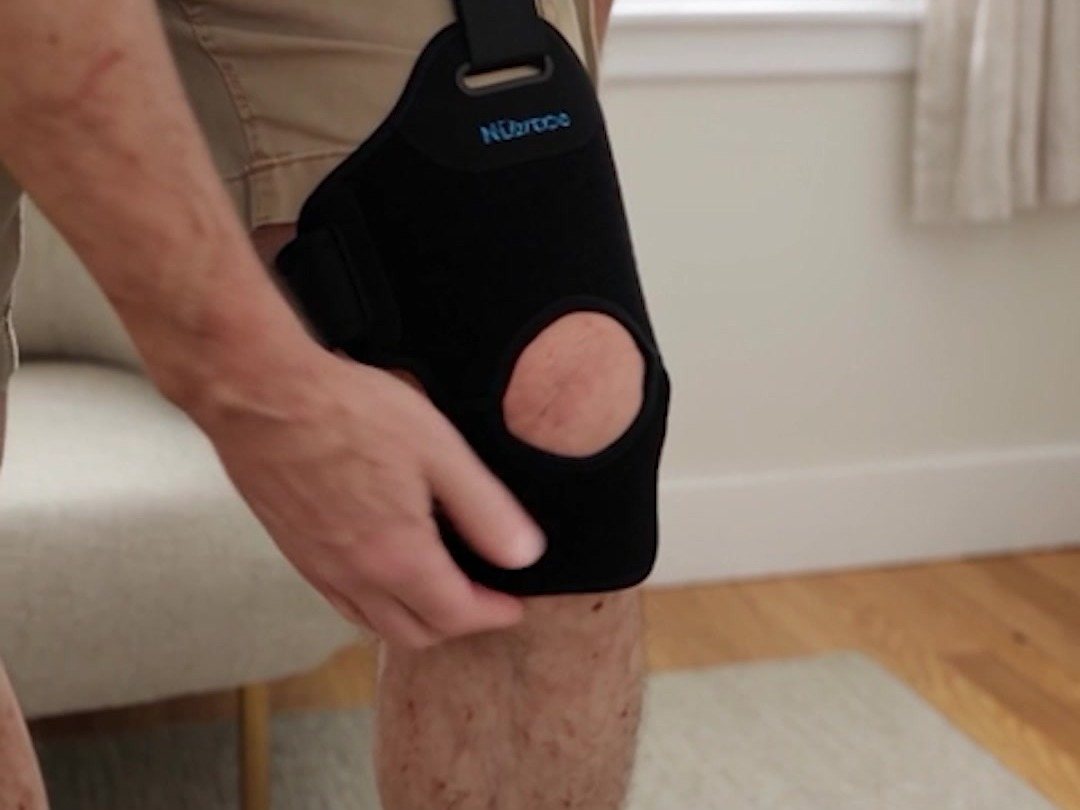 Knee wrap with kneecap opening being fitted